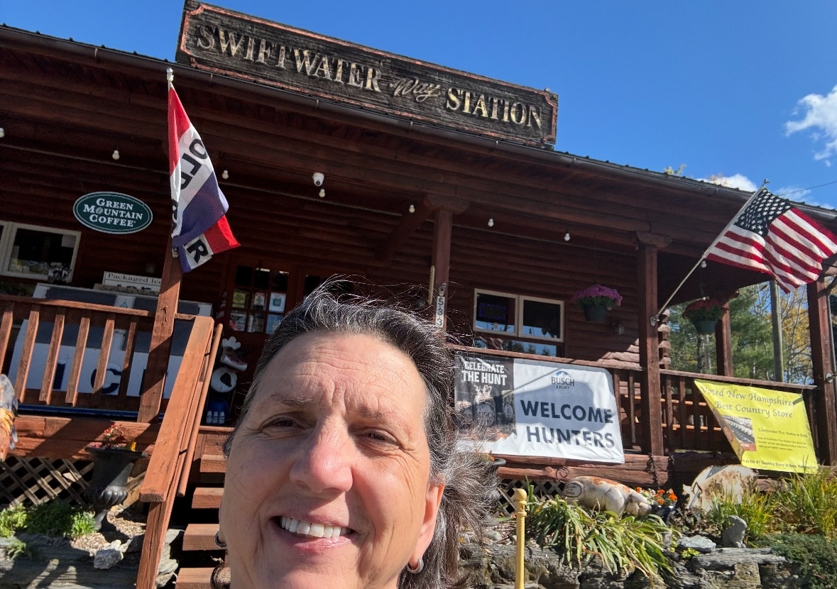 Happy customer selfie in front of Swiftwater Way Station